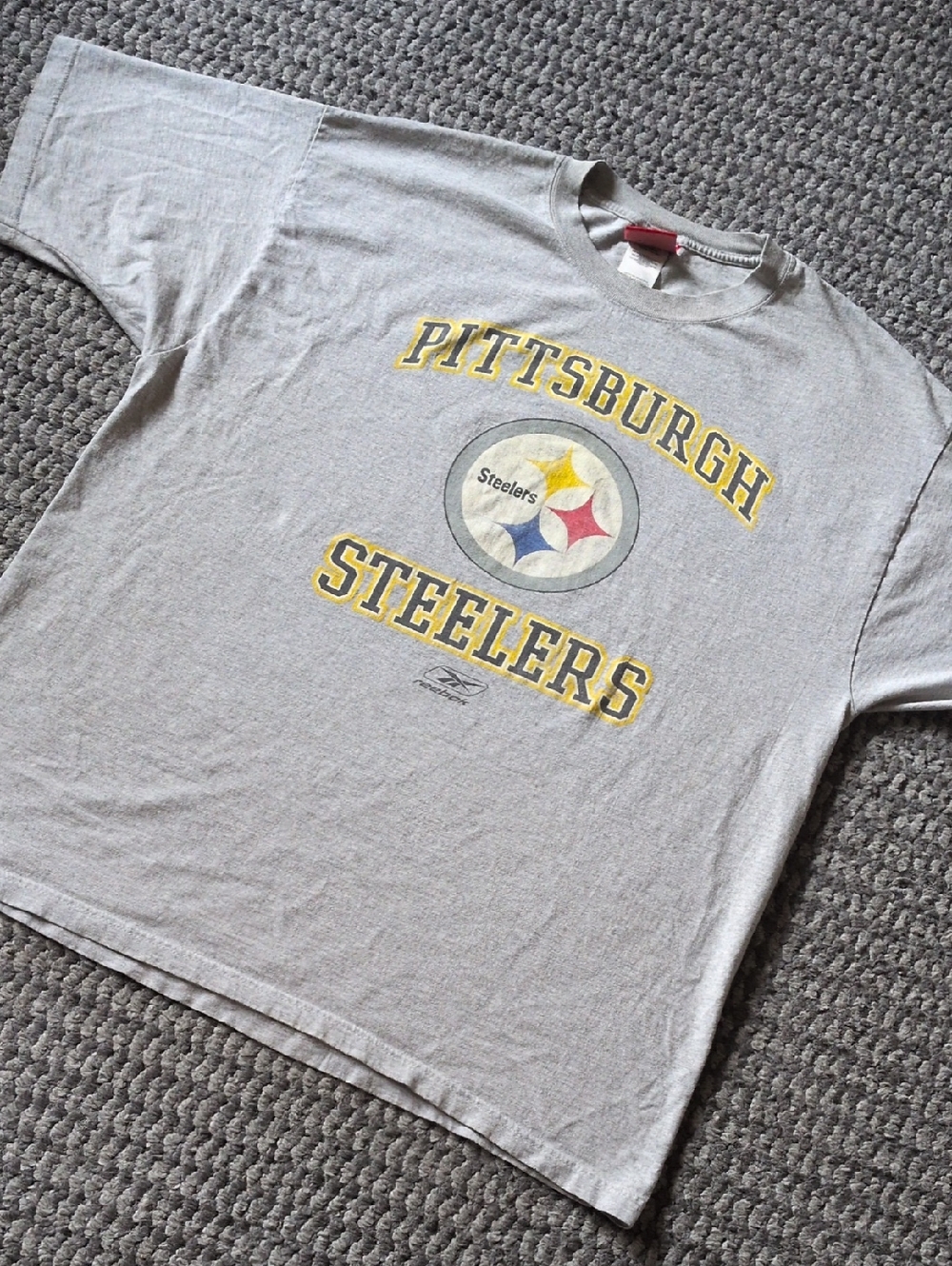 Vintage Reebok Gray Pittsburgh Steelers Short Sleeve Tee with Logo.